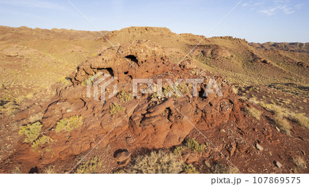 A volcanic place. Frozen old lava. Red Mountains A volcanic place. Frozen old lava. Red Mountains 107869575