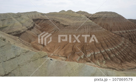 Colorful high mountains and a canyon made of clay Colorful high mountains and a canyon made of clay 107869579