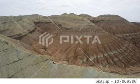 Colorful high mountains and a canyon made of clay Colorful high mountains and a canyon made of clay 107869580