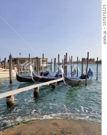 Classic view of Venice with canal and old buildings, Italy 107870123
