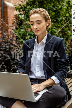 Young woman working and looking involved and focused 107871694