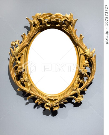 Vintage picture frame mockup, retro ornate gold baguette on wall Vintage picture frame mockup, retro ornate gold baguette on wall 107873727