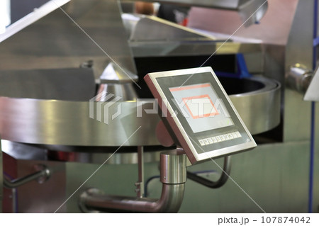 closeup of industrial automated cutter machine closeup of industrial automated cutter machine 107874042