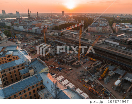 Building Rail Baltica project in the cenetr of Riga. Construction works of roads, railway and bridges in Riga. Building Rail Baltica project in the cenetr of Riga. Construction works of roads, railway and bridges in Riga. 107874947