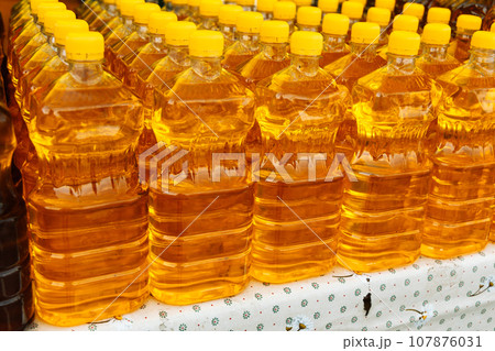 Plastic bottles with sunflower oil. Natural product. Food industry 107876031