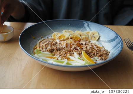Breakfast Granola Bowl With Banana And honey 107880222