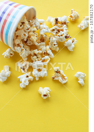 Popcorn bucket on yellow background 107882170