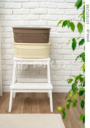 Plastic storage baskets in a bathroom interior Plastic storage baskets in a bathroom interior 107885298