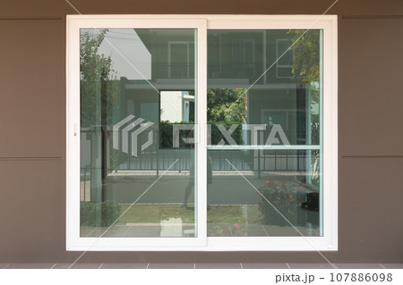 modern sliding glass door frame outside the house modern sliding glass door frame outside the house 107886098