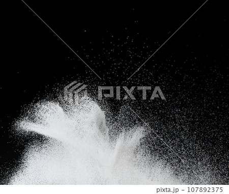 Million of white sand explosion, Photo image of falling down shower snow, heavy snows storm flying. Freeze shot on black background isolated overlay. Tiny Fine Salt sands as particle science 107892375