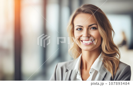Smiling businesswoman in office 107893484