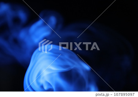 blue smoke on a dark background, colourful abstract blue smoke on a dark background, colourful abstract 107895097