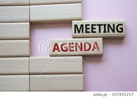 Meeting agenda symbol. Concept word Meeting agenda on wooden blocks. Beautiful pink background. Business and Meeting agenda concept. Copy space Meeting agenda symbol. Concept word Meeting agenda on wooden blocks. Beautiful pink background. Business and Meeting agenda concept. Copy space 107895257