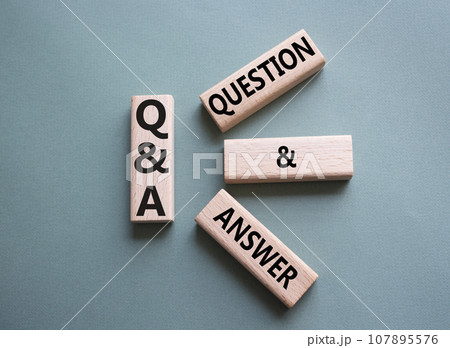 Q and A - Question and Answer. Wooden cubes with words Q and A. Beautiful grey green background. Business and Q and A concept. Copy space. 107895576