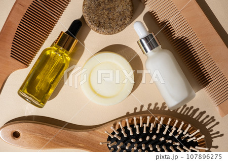 Natural Hair Care Concept - Solid Shampoo, Oils and Serums, Wooden Combs 107896275