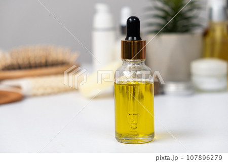 Natural oil for hair and skin care. Organic eco hair products. 107896279