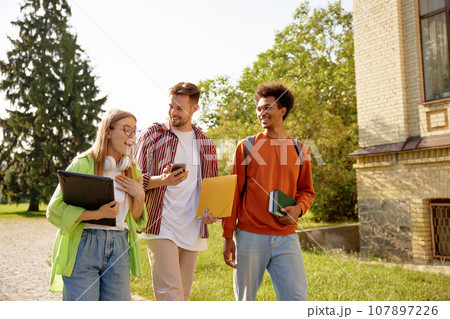Group of overjoyed students going for class in high school 107897226