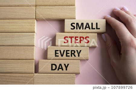 Small Steps Every Day symbol. Wooden blocks with words Small Steps Every Day. Beautiful pink background. Businessman hand. Business and Small Steps Every Day concept. Copy space. Small Steps Every Day symbol. Wooden blocks with words Small Steps Every Day. Beautiful pink background. Businessman hand. Business and Small Steps Every Day concept. Copy space. 107899726