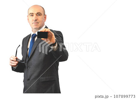 businessman with a black business card in hand businessman with a black business card in hand 107899773