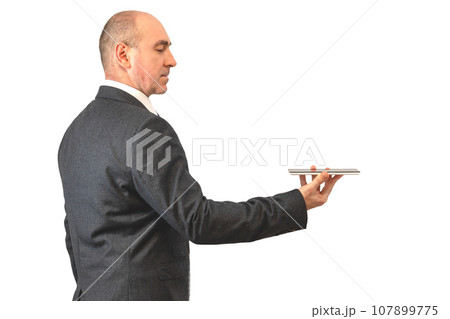 serious man with a tablet. businessman holding touchpad serious man with a tablet. businessman holding touchpad 107899775