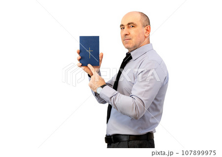 Man holding holy bible.Man With Bible. Man holding holy bible.Man With Bible. 107899975