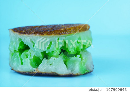 Bikang is a traditional Indonesian cake made with tapioca flour, coconut milk, sugar, and yeast. 107900648