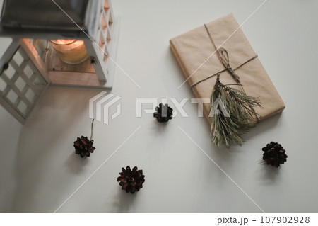 Christmas composition. Gifts, fir tree branches, decorations on white background. Christmas, winter, new year concept. Flat lay, top view, copy space Christmas composition. Gifts, fir tree branches, decorations on white background. Christmas, winter, new year concept. Flat lay, top view, copy space 107902928