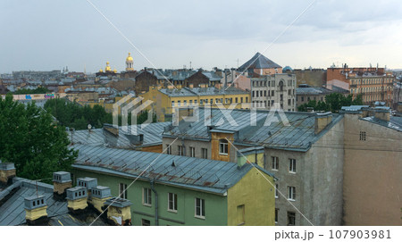 view of the roofs of the historical center of St. Petersburg on a cloudy day 107903981