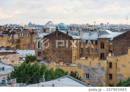 view of the roofs of the historical center of St. Petersburg on a cloudy day 107903983