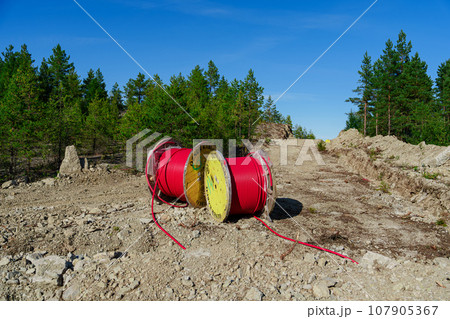 Laying High-Voltage Cables Underground Through the Forest to Connect Wind Turbines to the Power Grid 107905367