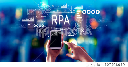 Robotic Process Automation theme with person using a smartphone at night 107908030