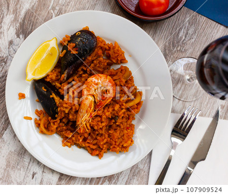 Seafood paella with lemon Seafood paella with lemon 107909524