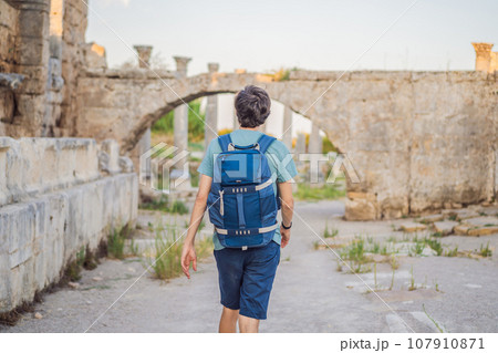 Tourist man at the ruins of ancient city of Perge near Antalya Turkey 107910871