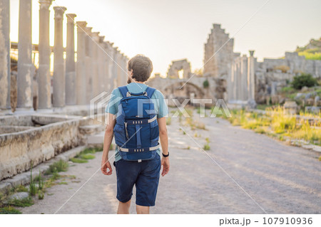 Tourist man at the ruins of ancient city of Perge near Antalya Turkey 107910936