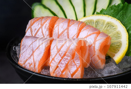 salmon belly sashimi 107911442