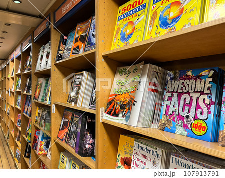 Colorful books with interesting facts stand on the bookshelves Colorful books with interesting facts stand on the bookshelves 107913791