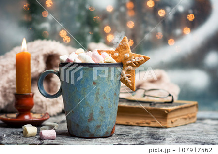 Warm marshmallow dessert beverage on Christmas decorated table Warm marshmallow dessert beverage on Christmas decorated table 107917662