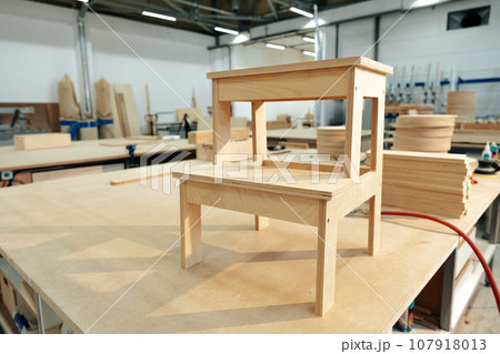 Manufactured small wooden ladder in a woodwork studio Manufactured small wooden ladder in a woodwork studio 107918013