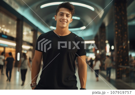 A young Colombian man in a black T-shirt at the mall 107919757