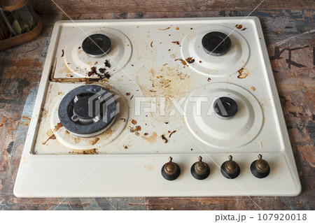 dirty stove close up in kitchen. concept of life, household routine dirty stove close up in kitchen. concept of life, household routine 107920018