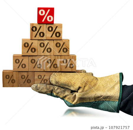 Gloved Hand Holding Wood Blocks with Percentage Signs Isolated on White Gloved Hand Holding Wood Blocks with Percentage Signs Isolated on White 107921757