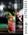 Desirable Alcoholic and Non-Alcoholic Cocktails on the Bar Counter, Adorned with Colorful, Natural, and Healthy Ingredients and Fruit Garnishes 107923053