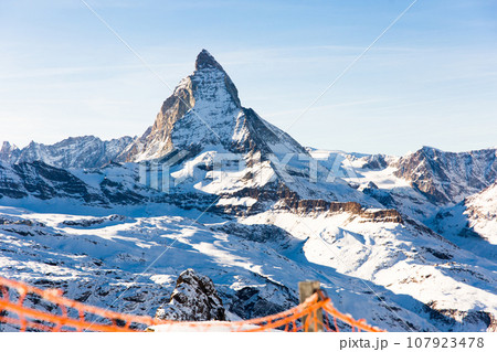 Snowy mountain Matterhorn during the day in winter. Zermatt, swiss alps 107923478