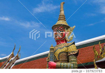 Giant statue in the Temple of the Emerald Buddha. Giant statue in the Temple of the Emerald Buddha. 107923783