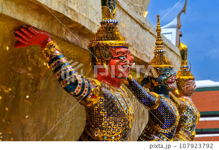 Giant statue in the Temple of the Emerald Buddha. Giant statue in the Temple of the Emerald Buddha. 107923792