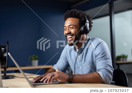 Adult African American smiling blogger hosts a podcast in the studio. An influencer uses a studio to record a podcast for the channel and subscribers. Vlogger shoots video using modern equipment 107925037