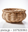 Empty wicker basket fruit or bread basket on white background. Vintage basket. 107926961
