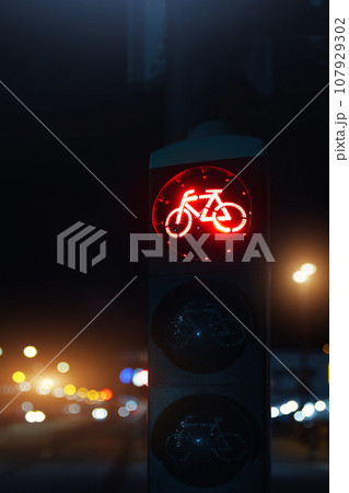Bicycle stop red warning lamp sign on traffic light road highway driveway drive crossroad intersection evening dark time german city. Bike forward movement prohibited on semaphore signal city street 107929302