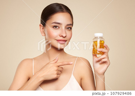 Beautiful Girl With Pill With Cod Liver Oil Omega-3 107929486