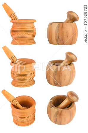 Set wooden mortar and pestle from different angles isolated on white Set wooden mortar and pestle from different angles isolated on white 107929723